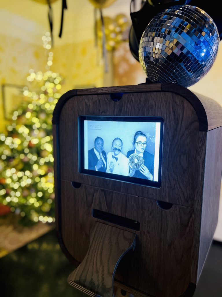A preview of an image on the screen of photo booth at corporate christmas party