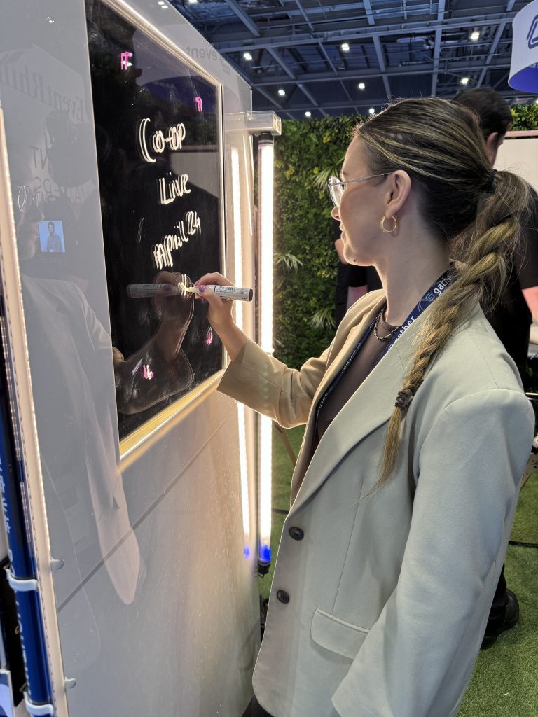lady drawing on scribble photo booth at event